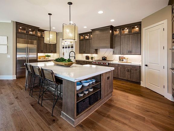 Oversized quartz island in chefs kitchen