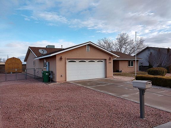 Front showing rv parking on shed