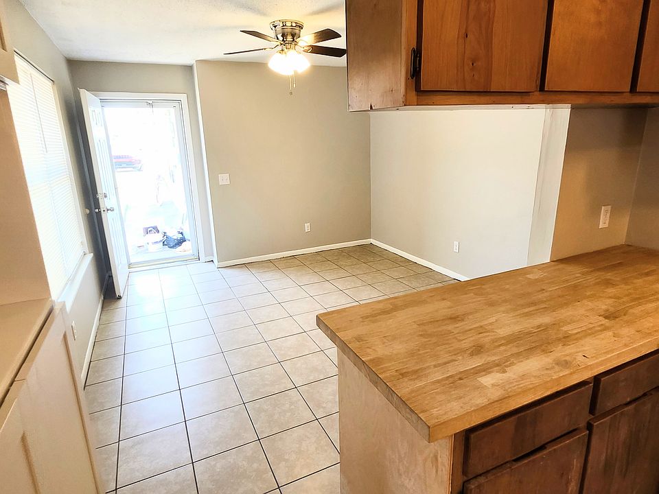 View from kitchen of glass front door and living room