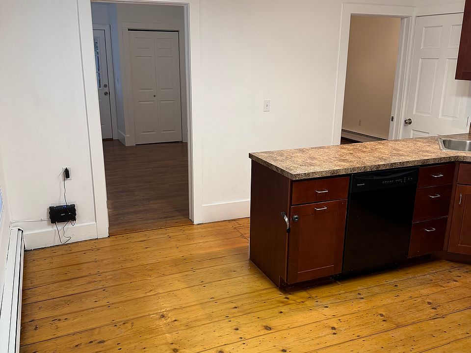 View of doors to both bedrooms, from the Kitchen