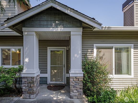 Covered front entry offers protection to you and your guests. No steps.>