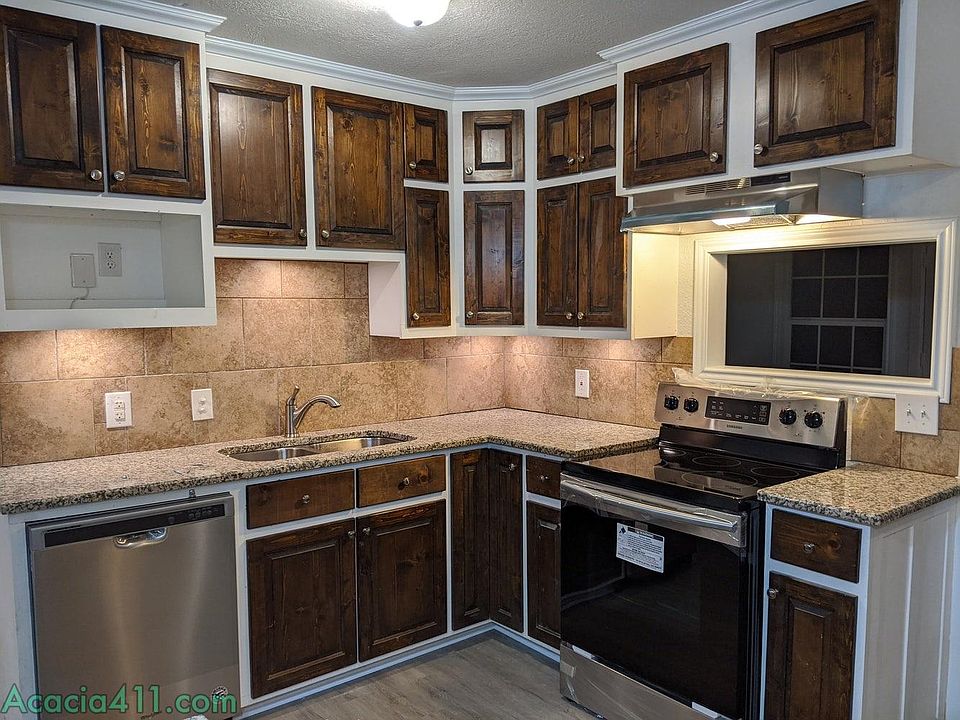 Kitchen with granite countertop and stainless steel appliances