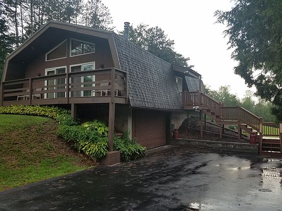 Asphalt driveway attached garage