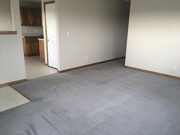 Living room, and part of kitchen/ dining area entry