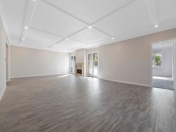 Living Room w/ Fireplace and Oversized Patio