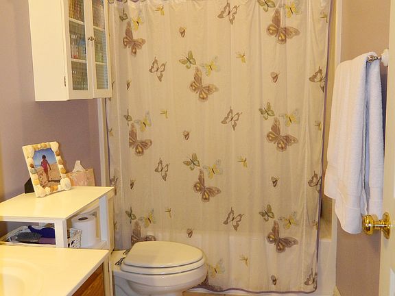 full bath with tile floors 
