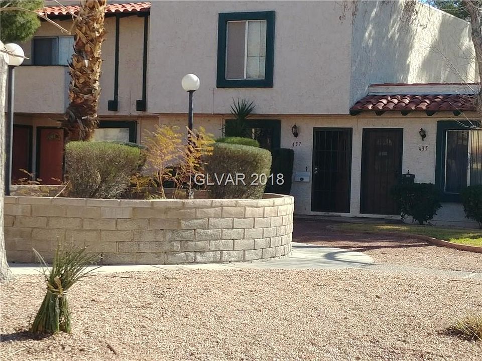 What a welcoming front door (on the left) with desert landscaping.