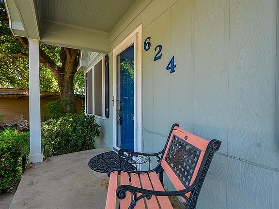 Welcoming entry with double doors and seating area space