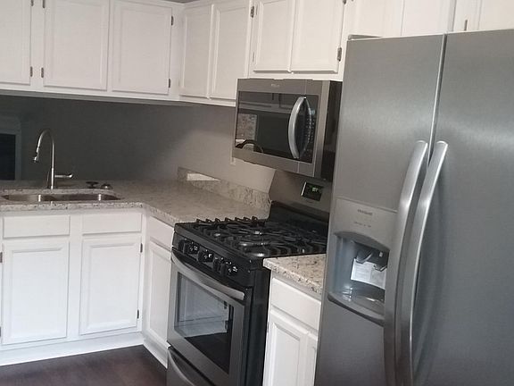All new stainless steel appliances in kitchen as well as gra