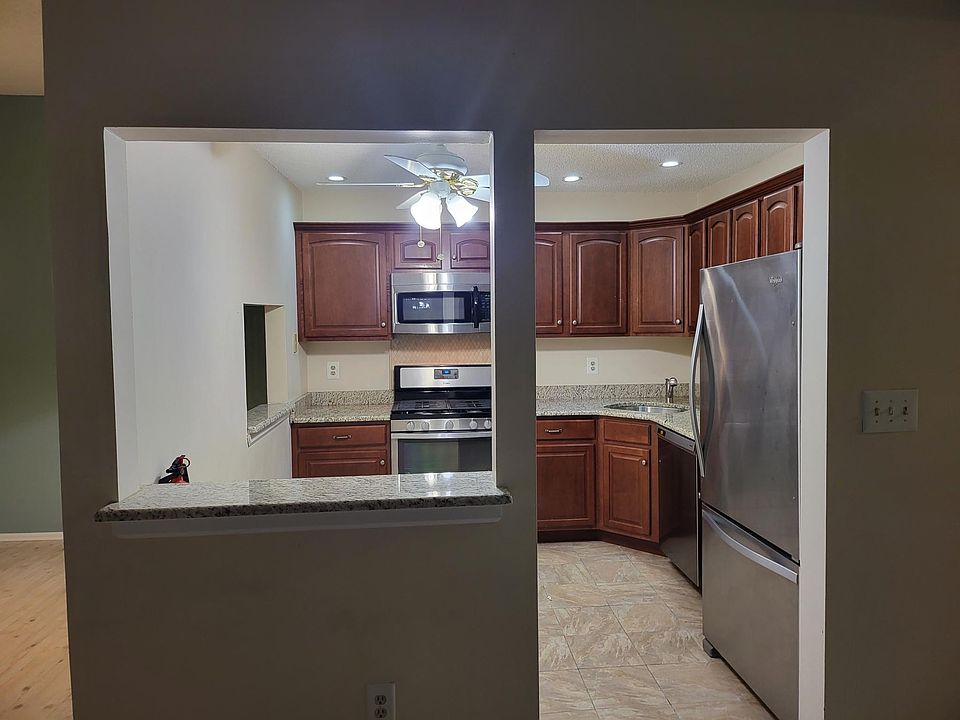 "Modern kitchen with sleek granite countertops and stainless steel appliances."
