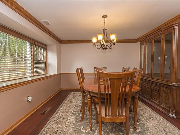 Your dining room features hardwood floors and crown molding.