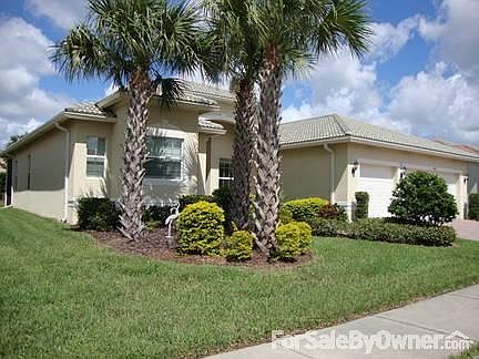 Front View
						:
						Mature trees and bushes surround