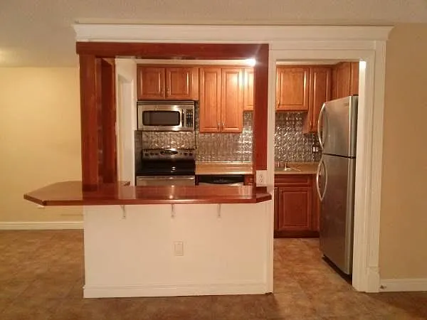 Remodeled kitchen with cherry cabinets and all stainless app