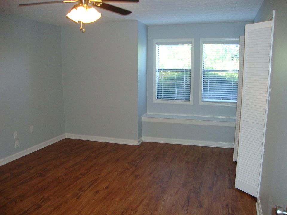 The bedroom has lots of space and light with a large closet. There is also a built-in window seat, bookshelves, and desk.