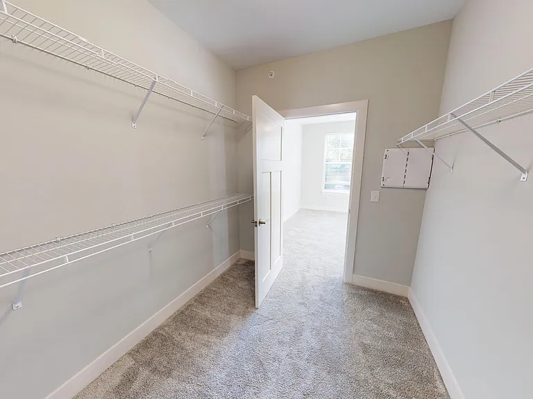 The Elm includes a walk-in closet that joins the bedroom and bathroom. The Elm includes a walk-in closet that joins the bedroom and bathroom.