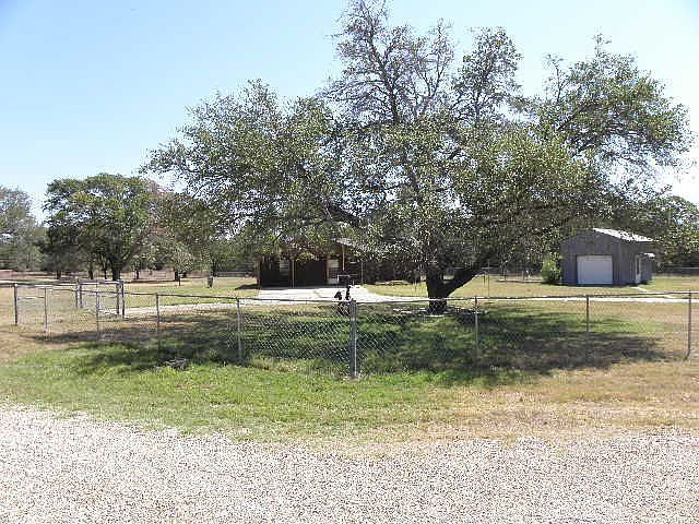 Nice 2 Acres fenced with 3 garages on the Proeprty