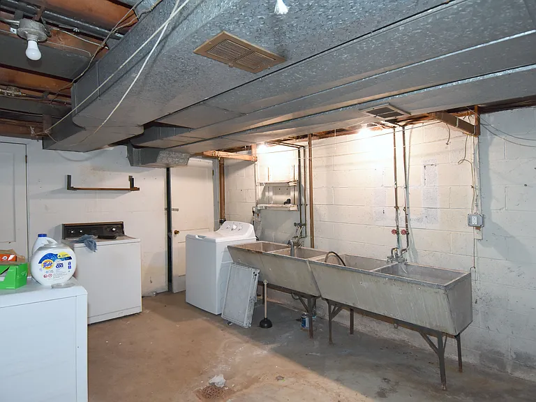 Shared laundry area has separate washer/dryer utility hookups.