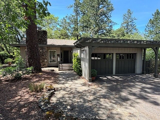 Front of house & two car garage.