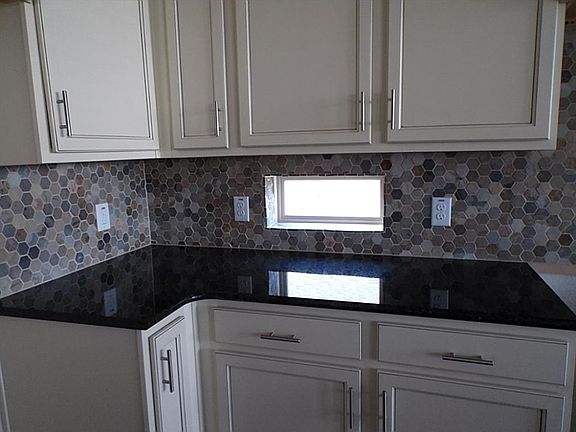 NEW! Brookstone Collection, "Emory" kitchen with granite countertops.