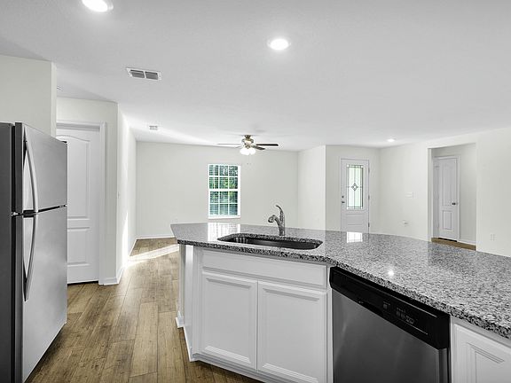 The kitchen comes chef-ready with stainless steel appliances