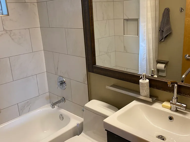 Full bathroom with shower and bath