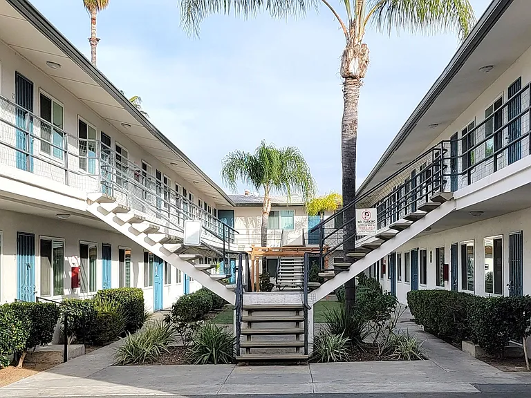 Full view of courtyard at Orlando Woods Apartments in El Cajon, California.