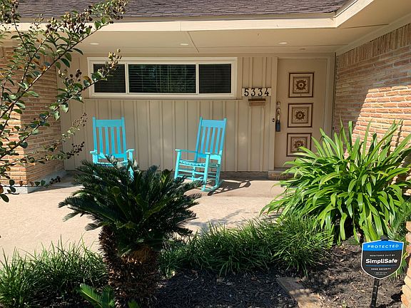 Inviting front porch with undereaves lights. Located on quiet street.
