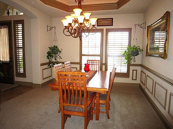 Another view of the light and bright dining room with Plantation shutters