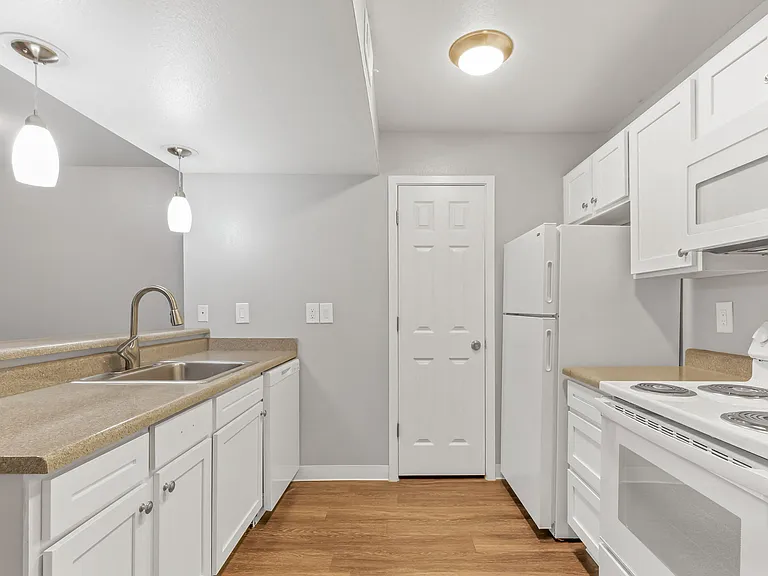 A Kitchen at The Buttes Apartment Homes in Loveland, CO