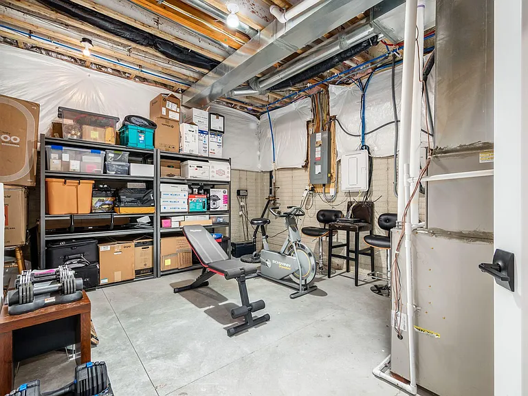 Storage space in basement, doubles as gym.