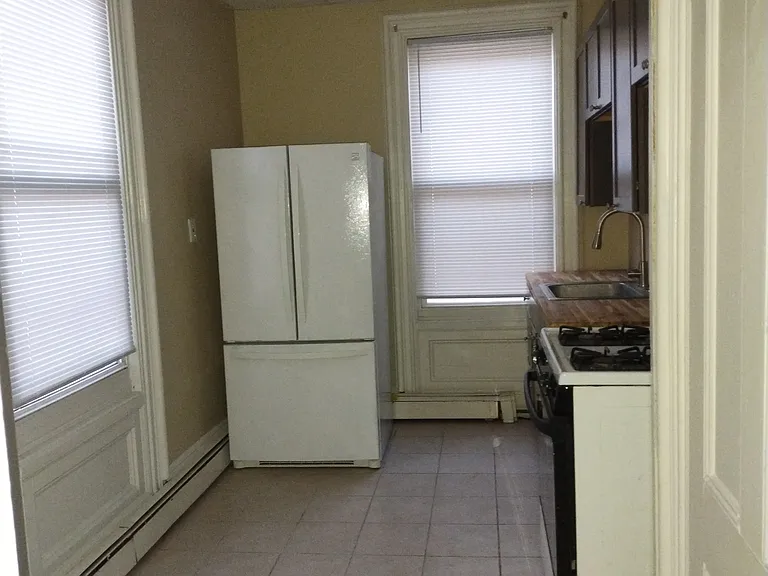 Kitchen. Kitchen pantry door on right.