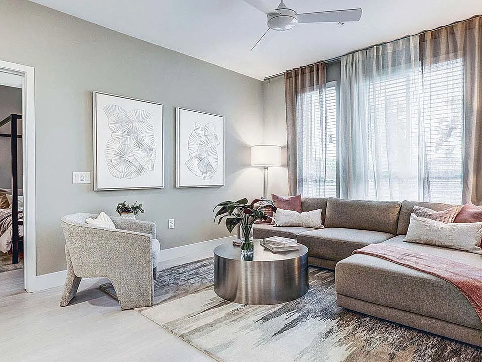 Griffis Platinum Triangle apartment living room with wood style floor.