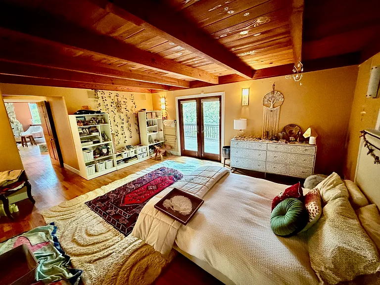 Second floor, master bedroom, with French door access to the wrap around terrace.