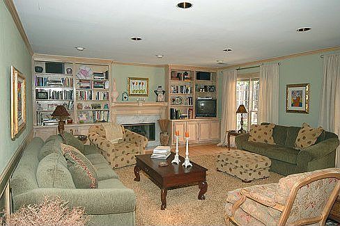 Den with fireplace and built ins