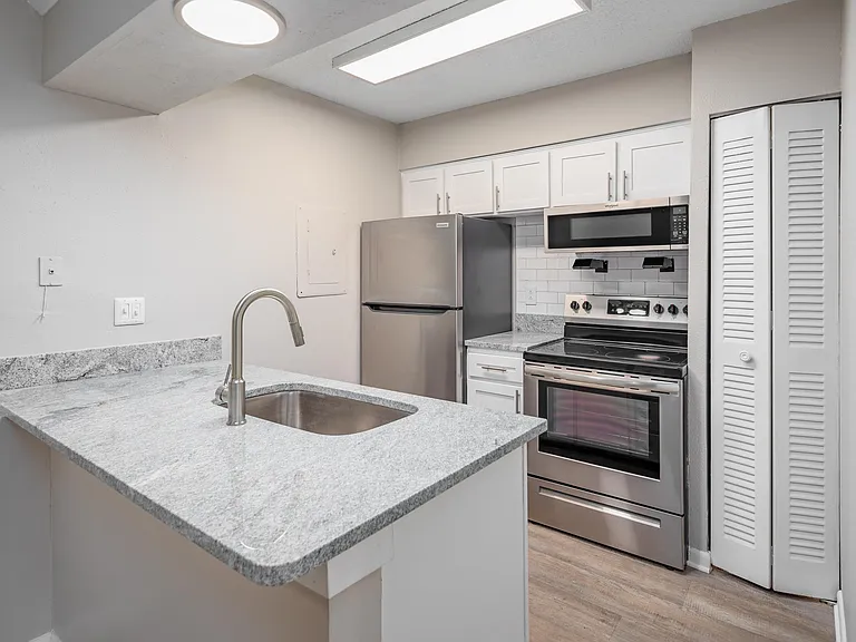 Kitchen with granite counters and stainless appliances