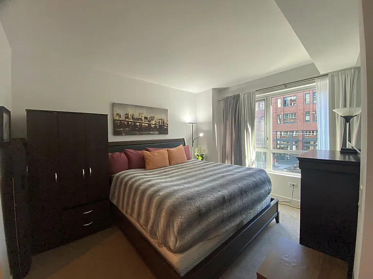 large primary bedroom king size bed walk in closets, plus tons of drawers/ cabinets