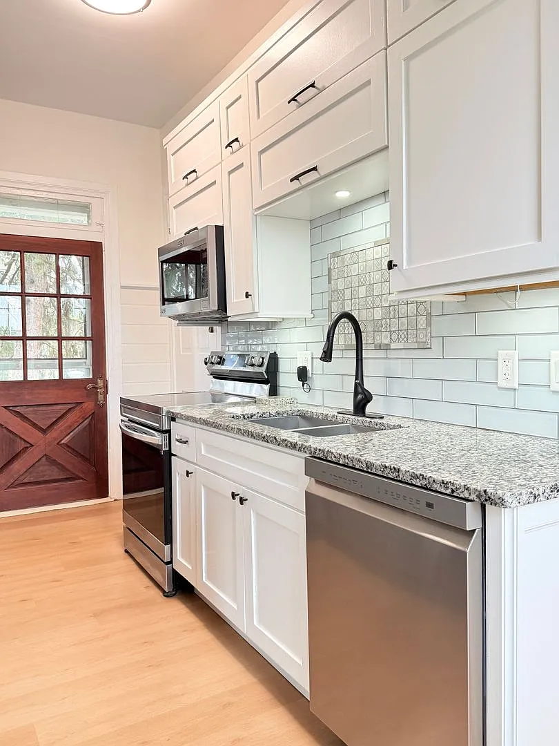 Renovated 2BR + Bonus Room | Garage | In-Unit Laundry | Covered Deck — Photo 3