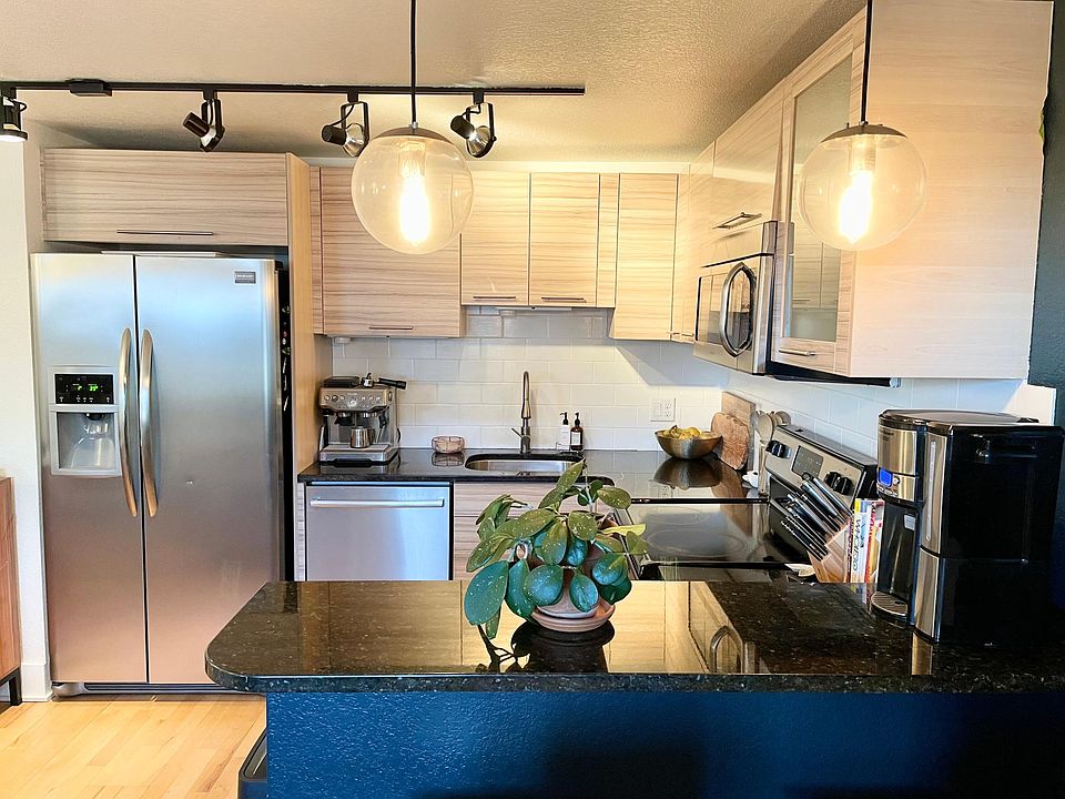 Kitchen with new Bosch dishwasher, granite countertops, and stainless steel appliances