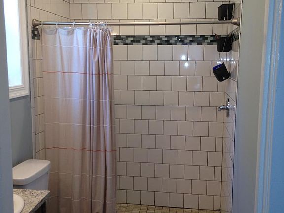 Bathroom w/ granite and ceramic tile