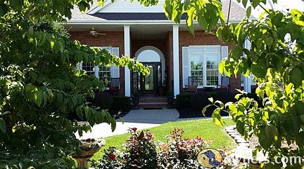 Large Tiled Front Porch with ceiling fans
