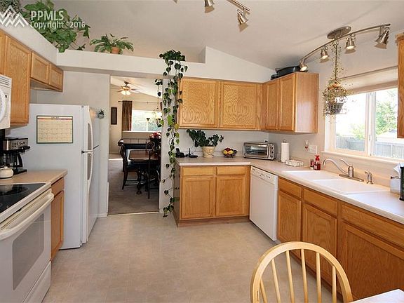 A spacious kitchen with appliances included and new light fixtures.