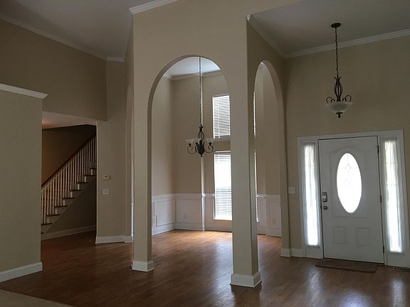 View of formal dining room and foyer from living room