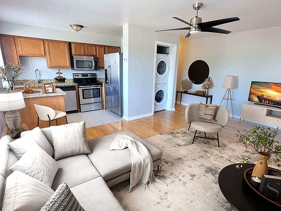 Showing washer & dryer door open. Sliding door to hide unit.