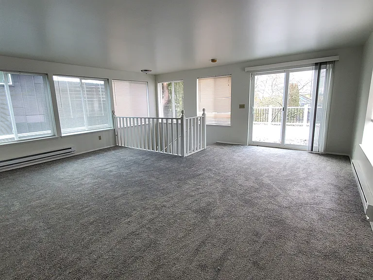 Bedroom 1: Large bedroom suite upstairs is filled with natural light, and has a deck.