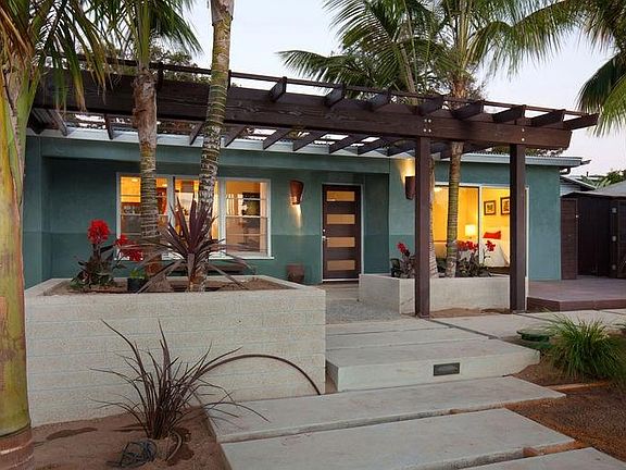 Beautifully Landscaped Front Yard With Firepit & Water Fall - yard was just planted in this photo