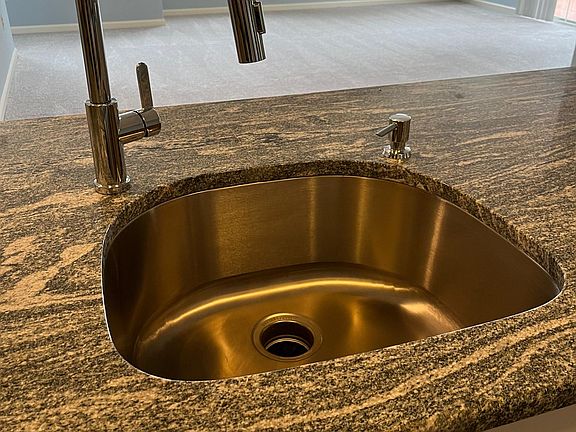 Granite counter with undermount sink, new faucet and soap dispenser