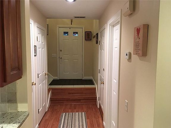 Entrance, foyer.  Pantry/storage closet.  Laundry on 1st floor.  W/D stay.  Garage door and then 1/2 bath to right
