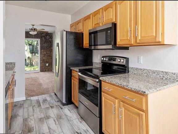 Kitchen with granite counter-tops and stainless steel appliances