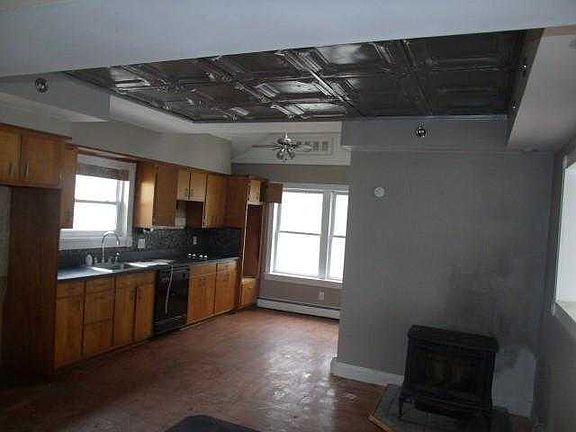 large open kitchen with pellet stove