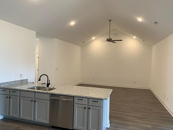 Awesome gathering space for entertaining. Easily would fit two sofas, two chairs, coffee table, and TV table. This wall is just screaming for a big screen TV! It's bright and wonderful in here.
